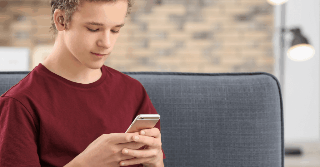 A boy using the visualfy ios mobile app