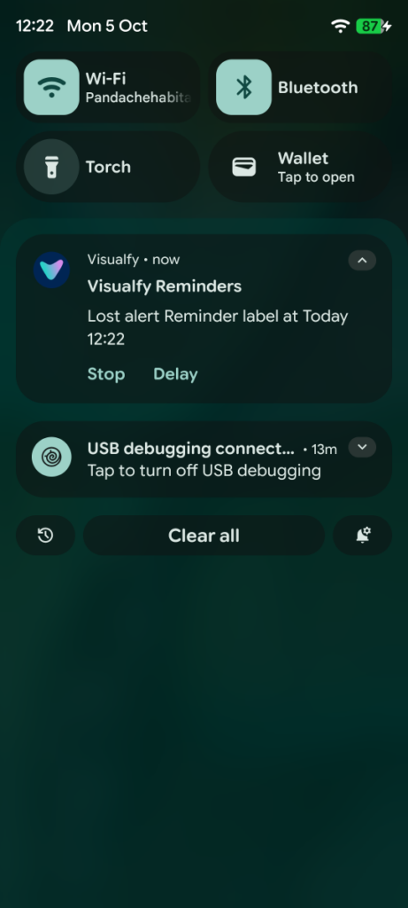 Expanded notification with the “Snooze” and “Stop” buttons